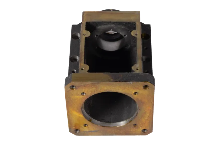 Cast iron gearbox housing casting with machined openings and bolt-hole pattern
