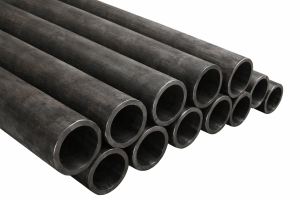 Stacked carbon steel round tubes with dark mill scale surface