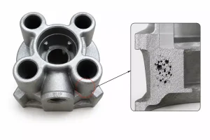Gravity cast aluminum mounting component showing shrinkage porosity near boss junction