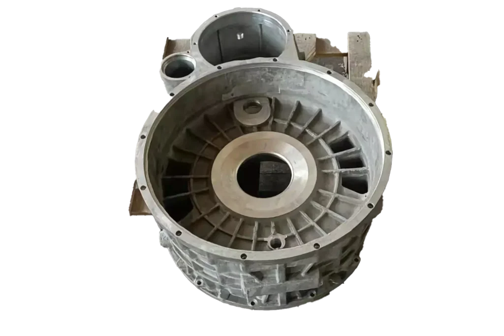Gravity casting housing component with machined surfaces and ribbed structure