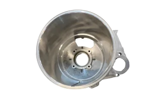 Low pressure die cast aluminum housing showing internal cavity and machined mounting holes
