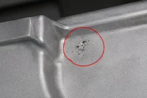 Shrinkage porosity on low-pressure die cast aluminum surface