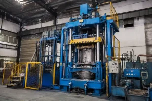 Low pressure die casting machine in an industrial foundry workshop