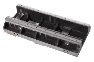 Industrial machine base frame with machined mounting surfaces and reinforcement ribs