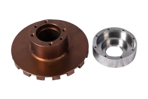 Machined industrial rotor component with central hub and mounting holes