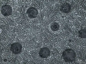 Microstructure of austempered ductile iron showing graphite nodules and ausferritic matrix