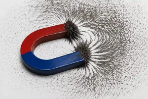 Horseshoe magnet showing magnetic field lines with iron filings