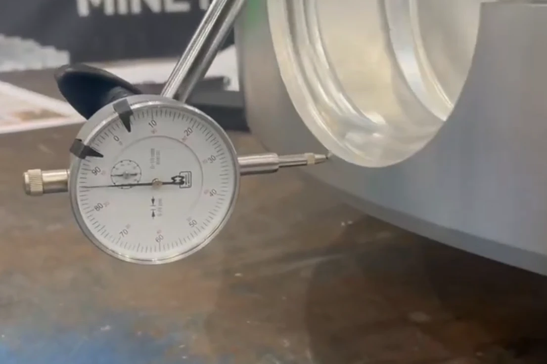 Dimensional inspection of a machined casting using a dial indicator