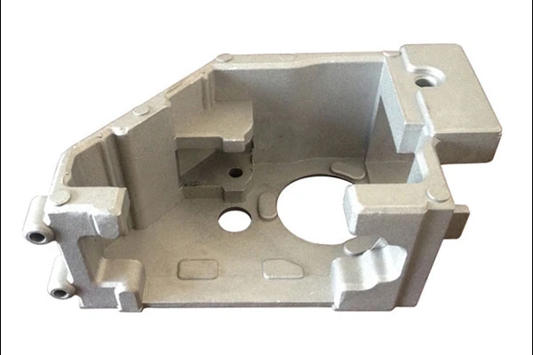 Aluminum die cast housing with an open cavity and mounting tabs