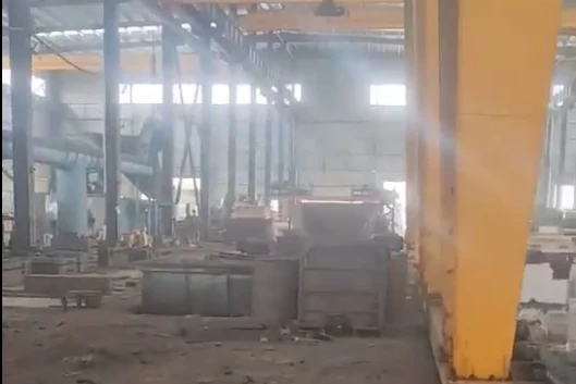 Industrial casting workshop with large foundry equipment